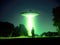 Mysterious Encounter: Man Standing near a Vibrant Green UFO Spaceship
