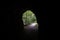 Mysterious exit from a cave to green forest. Light at the end of the tunnel concept. Footpath on hiking trail, cave in the