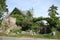 Mysterious house with gate made from trees