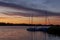 A mysterious landscape with sailing boats after sunset at Kalwa lake