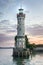 Mysterious lighthouse at evening in harbor of Lindau in lake Con