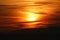 Mysterious looking cloudy sky at sunset over high mountains