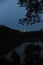 Mysterious and magic glowing full moon reflecting in a lake during night in Poland in Europe