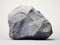 Mysterious Monolith: Enigmatic Gray Rock on Stark White Background