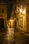 Mysterious narrow alley with lanterns in Prague at night
