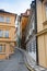 Mysterious narrow alley with lanterns in Prague at night