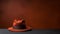 Mysterious Orange Hat On Dark Table: Poetcore Americana Minimalist Image