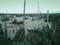 Mysterious scary empty uninhabited swamp with dead trees and old abandoned boats. Monochrome natural background for