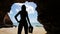 mysterious silhouette girl at beach in cave
