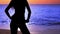 mysterious silhouette girl at beach during sunset