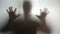 Mysterious silhouette with hands up, going to scare, nightmare person in stress