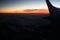 Mysterious sunset with clouds from the airplane window with