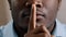 Mysterious unknown male face part african american adult man put finger to lips ask be quiet make gesture silence show