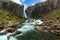 A mysterious waterfall hidden in nature in the Icelandic countryside