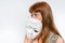 Mysterious woman cover her face behind anonymous mask