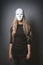 Mysterious woman hiding face and identity behind white mask