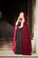 Mysterious woman in red cloak