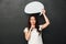 Mystery asian woman in t-shirt holding blank speech bubble