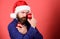 Mystery of Christmas. Mysterious Santa Claus. Naughty is new nice. Man with beard hold red balls christmas decorations