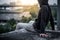 Mystery man in white mask sitting on rooftop of abandoned building