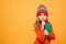 Mystery Young girl in sweater and hat holding book