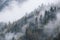 Mystic cloudy and foggy autumn alpine mountain slopes scene. Austrian Lienzer Dolomiten Alps