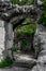 Mystic Door Of Decayed Building Overgrown By A Gnarly Tree