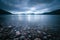 Mystic landscape lake scenery in Scotland: Cloudy sky, sunbeams and mountain range in loch Linnhe