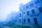 Mystic landscape of old French colonial building in the mist, old abandoned unfinished building of Bokor Casino, Borkor Mountain,