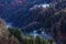 Mystic mountain forest with wafts of mist, autumnal scenery, aerial view