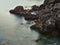 Mystic water and rocks at the ocean - Long exposure nice lanscape with stones on the sea beach. View of water like fog and mist