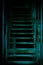 Mystical horror staircase to a dark basement, attic in an old decrepit scary abandoned house with paranormal blue green light and