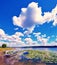 Mystical landscape with boats among water lilies on a pond on a background of clouds idyll, meditation, anti-stress, rest -