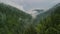 Mystical landscape in a rainy day with mountains forested with firs