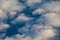 Mystical moon in the evening sky surrounded by  clouds