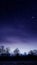 Mystical moonlit sky in purple gradient with clouds, perfect as phone background illustration