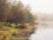 Mystical morning landscape with fog over the lake. Soft focus