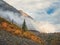 Mystical mountain valley. Autumn poster of Altai mountains. Sunny autumn scene of mountain valley. Landscape photography.