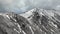 Mystical Mountains: Aerial Vantage Point on Cloud-Enveloped Peaks