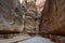 Mystical narrow passage between gigantic rocks in Petra