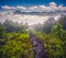 Mystical path in foggy mountains