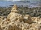 Mystical stone piles and figures on the beach in Albufeira, Algarve - Portugal