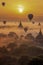 Mystical Sunrise Over Ancient Temples with Colorful Hot Air Balloons. ai generative