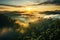 Mystical view from top on forest under haze at early morning. Eerie mist among layers from tree silhouettes in taiga under predawn