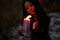 Mystical Witch Woman With Candles In Her Hands Performs An Occult Mystical Ritual