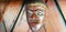 Mystical wooden mask and artworks in traditional retro Javanese style