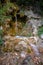 Mystically atmospheric waterfall with green moss and rocks