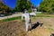 Mystique view of scarecrow and his shadow friend standing in farm garden and get ready for Halloween party