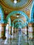 Mysuru palace inside view. A series of pillars with greenish blue colors on the walls