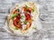 Naan bread and chicken vegetables stir fry in light wood rustic background.